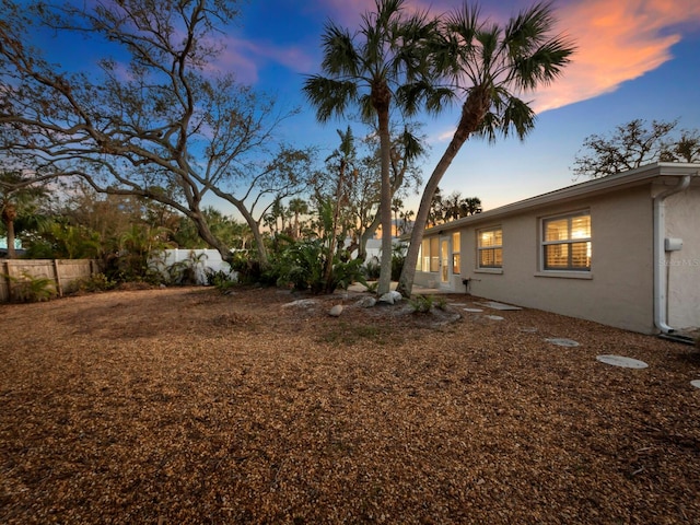 view of yard at dusk