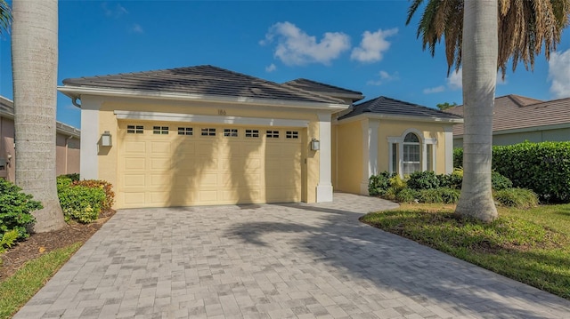 view of front of property with a garage