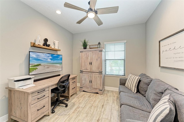 office space featuring ceiling fan and light wood-type flooring