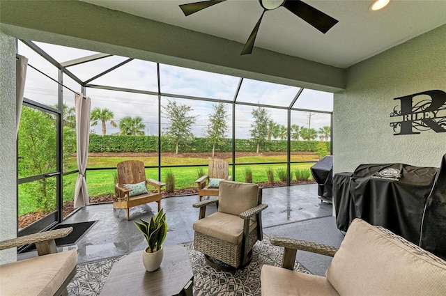 sunroom featuring plenty of natural light and ceiling fan