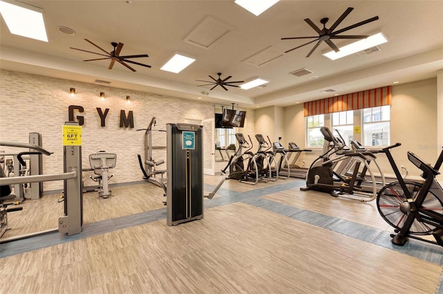 exercise room featuring light hardwood / wood-style floors