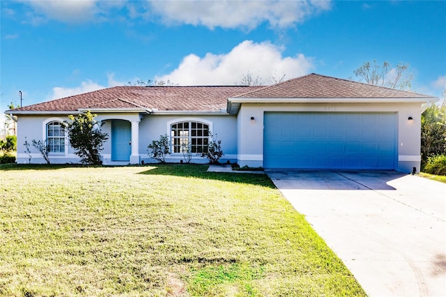 view of front of house featuring a front yard and a garage