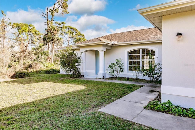 property entrance featuring a yard