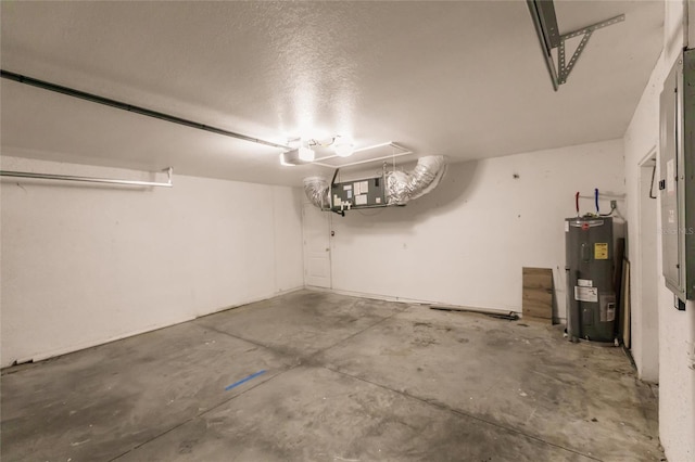 garage featuring a garage door opener and electric water heater