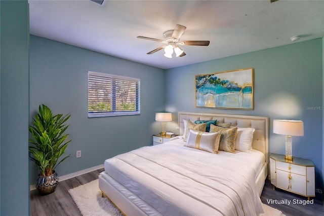 bedroom featuring dark wood-type flooring and ceiling fan