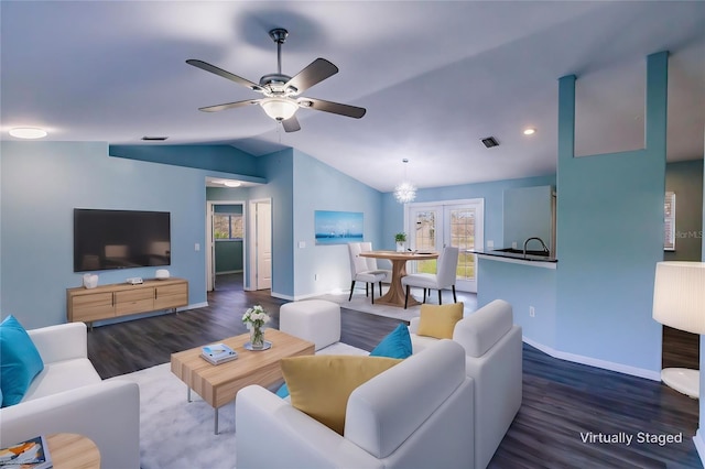 living room with ceiling fan, dark wood-type flooring, and lofted ceiling