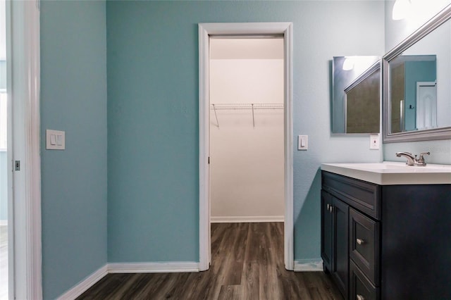 bathroom featuring hardwood / wood-style floors and vanity