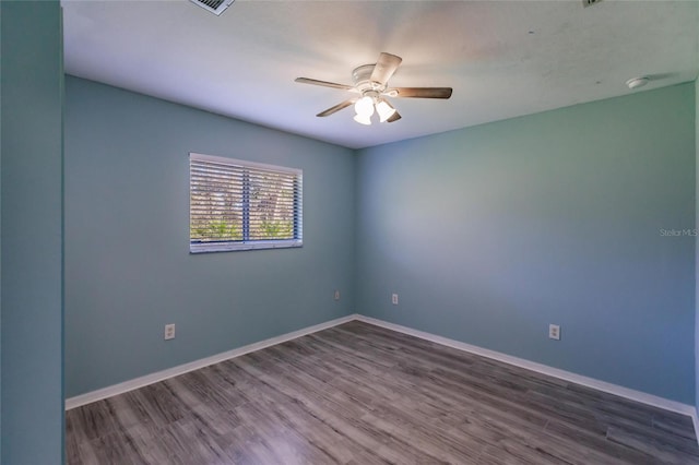 spare room featuring ceiling fan and wood-type flooring