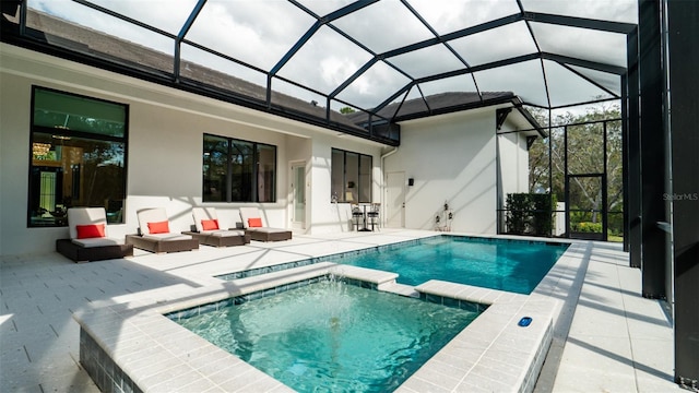 rear view of property featuring a patio, glass enclosure, a pool with hot tub, and an outdoor hangout area