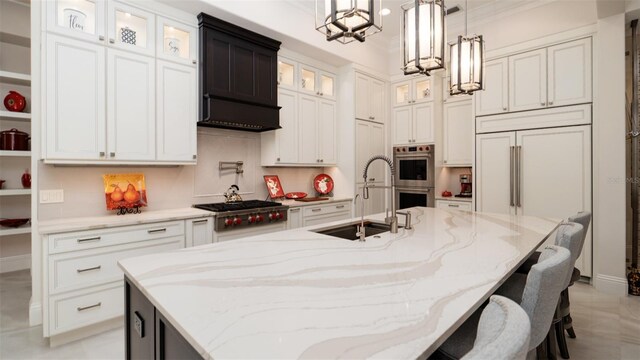 9260 Swaying Branch Rd, Sarasota, FL 34241 - kitchen with a sink, appliances with stainless steel finishes, a large island, white cabinetry, and premium range hood