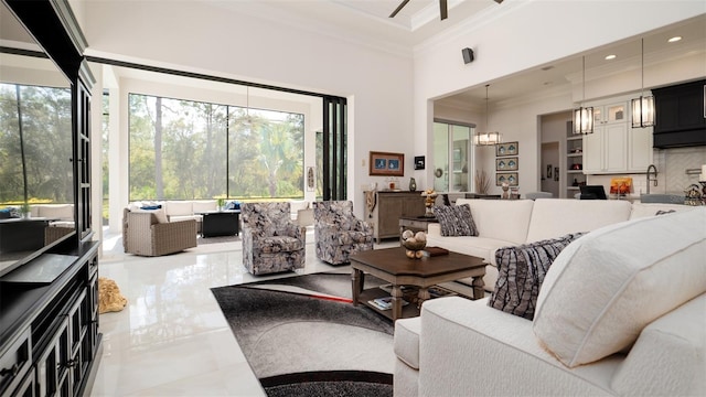 9260 Swaying Branch Rd, Sarasota, FL 34241 - tiled living area with crown molding, a high ceiling, a chandelier, and a ceiling fan