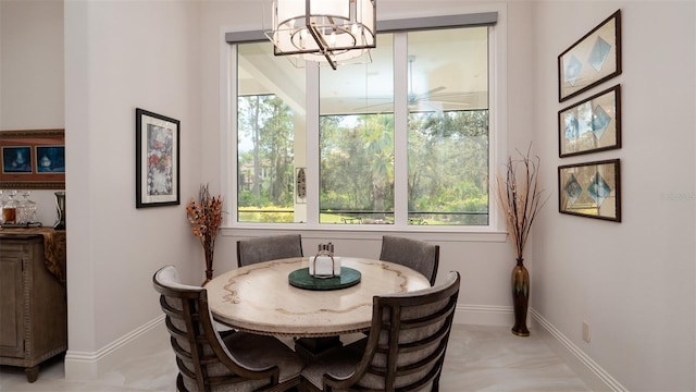 dining area with a notable chandelier and a healthy amount of sunlight