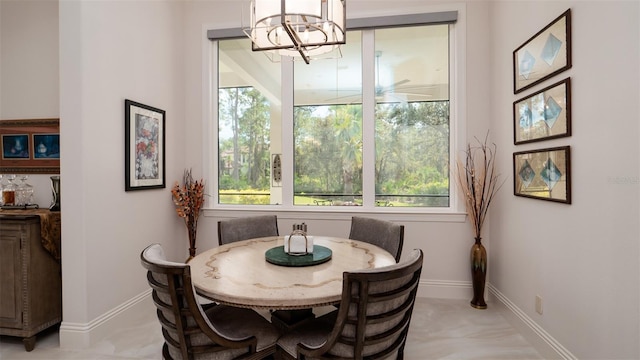 9260 Swaying Branch Rd, Sarasota, FL 34241 - dining space featuring plenty of natural light, a chandelier, and baseboards