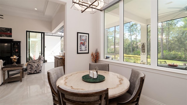 9260 Swaying Branch Rd, Sarasota, FL 34241 - dining space featuring healthy amount of natural light, a chandelier, and ornamental molding