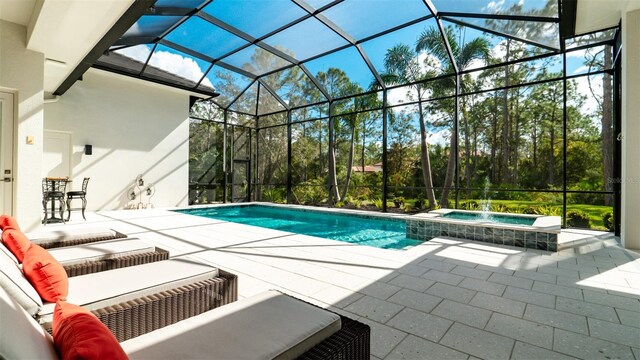 9260 Swaying Branch Rd, Sarasota, FL 34241 - view of swimming pool with a patio area, a pool with connected hot tub, and glass enclosure