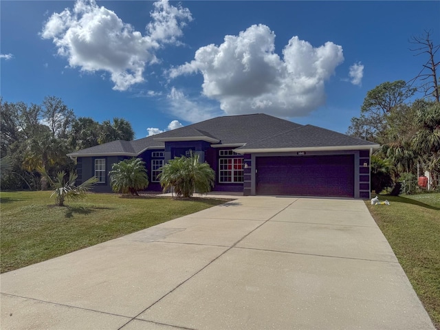 view of front facade featuring a garage and a front yard