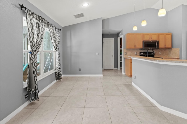 kitchen with black stove, decorative light fixtures, light tile patterned floors, high vaulted ceiling, and decorative backsplash