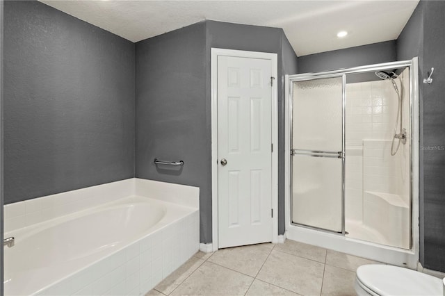 bathroom with toilet, independent shower and bath, and tile patterned flooring