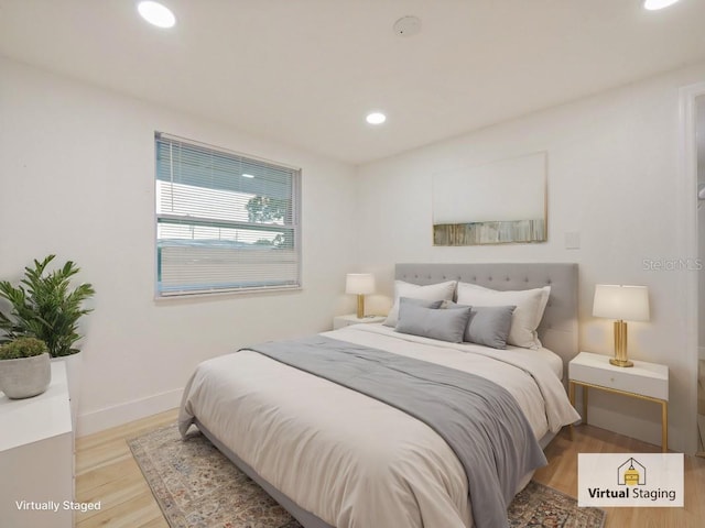 bedroom with light hardwood / wood-style flooring