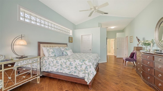 bedroom with hardwood / wood-style flooring, lofted ceiling, and ceiling fan