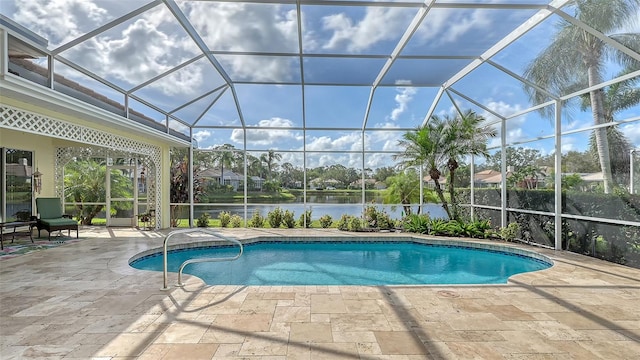 view of swimming pool featuring a water view, glass enclosure, and a patio