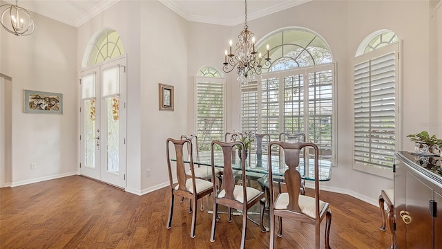 dining area with french doors, a chandelier, a healthy amount of sunlight, and dark hardwood / wood-style flooring