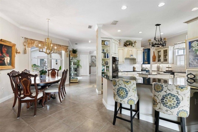 4561 Murcia Blvd Unit 13, Sarasota, FL 34238 - kitchen featuring a chandelier, oven, cream cabinetry, recessed lighting, and crown molding