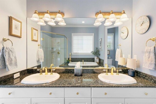 4561 Murcia Blvd Unit 13, Sarasota, FL 34238 - full bath with a shower stall, double vanity, a bath, and crown molding