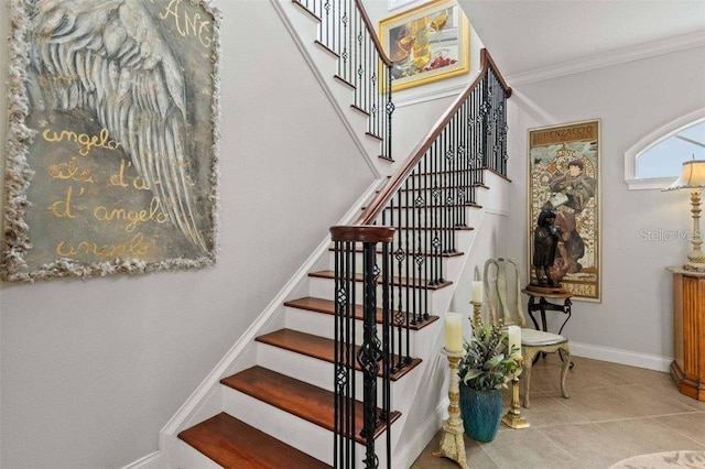 4561 Murcia Blvd Unit 13, Sarasota, FL 34238 - staircase featuring ornamental molding, tile patterned floors, and baseboards