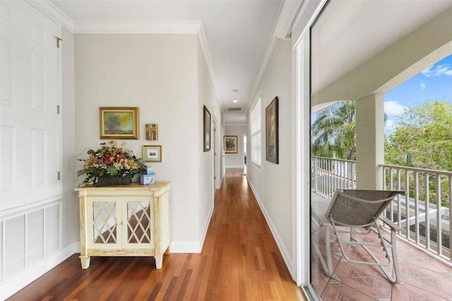 4561 Murcia Blvd Unit 13, Sarasota, FL 34238 - corridor featuring crown molding, wood finished floors, and baseboards