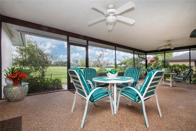 sunroom / solarium with a wealth of natural light and ceiling fan