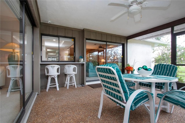 sunroom / solarium with ceiling fan