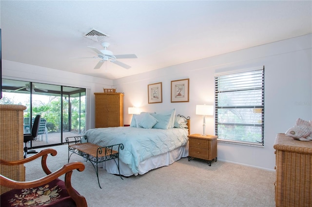 carpeted bedroom featuring access to outside and ceiling fan