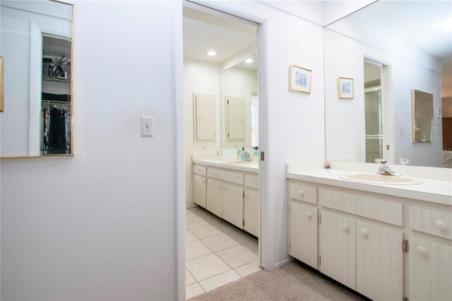 bathroom with vanity and tile patterned flooring