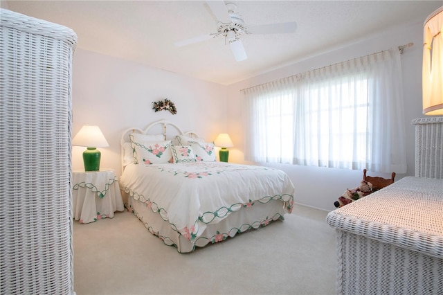 bedroom featuring ceiling fan and carpet floors