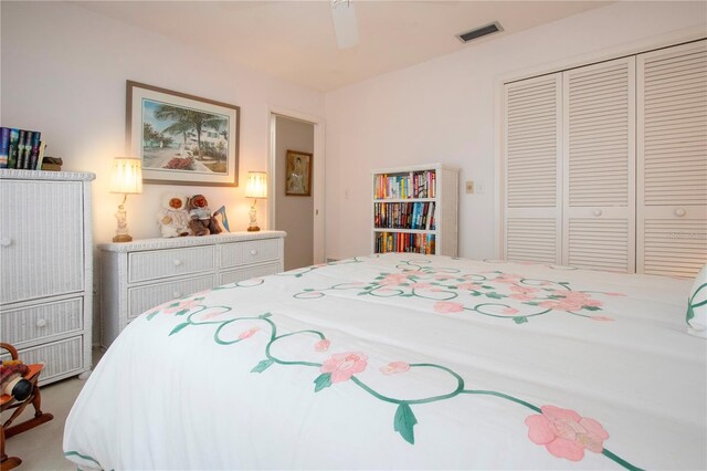 bedroom with a closet, carpet, and ceiling fan