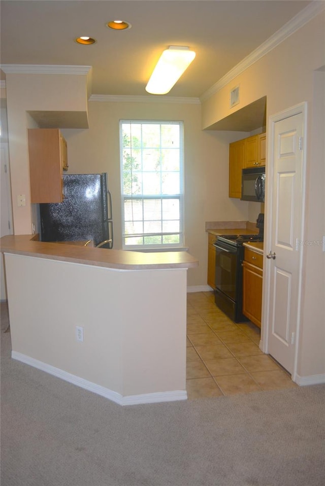 kitchen with light colored carpet, black appliances, kitchen peninsula, and ornamental molding