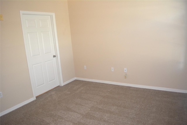 unfurnished room with carpet