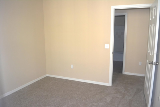 empty room featuring light colored carpet