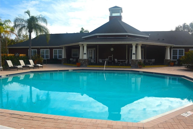 view of swimming pool with a patio