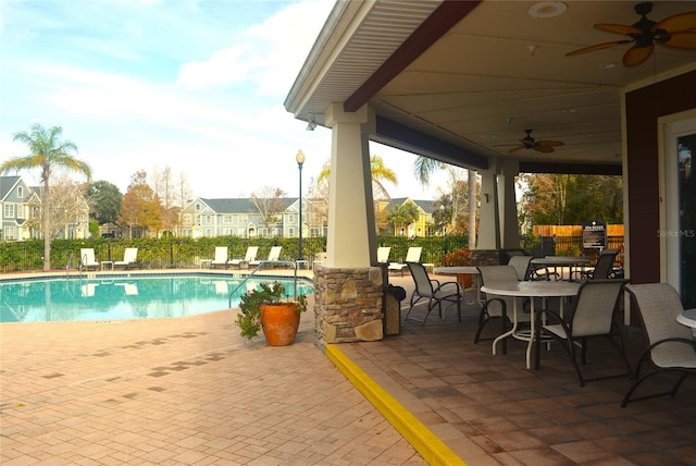 view of pool featuring ceiling fan and a patio area