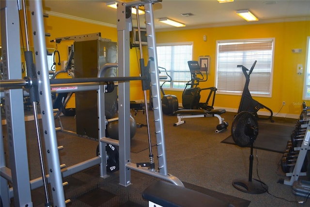 workout area with crown molding