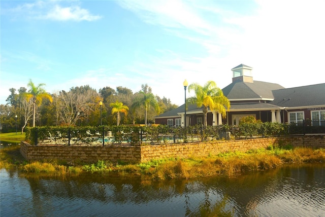 surrounding community with a water view