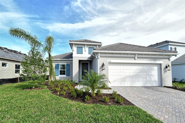 view of front facade featuring a garage and a front yard