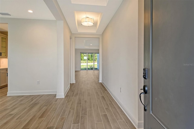 hallway with light hardwood / wood-style flooring