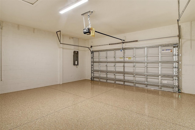 garage featuring electric panel and a garage door opener