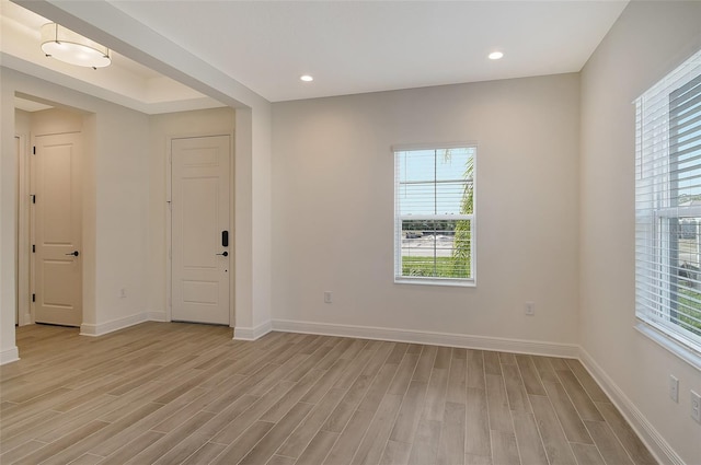 spare room featuring light wood-type flooring