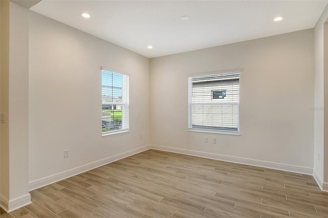 spare room featuring light wood-type flooring