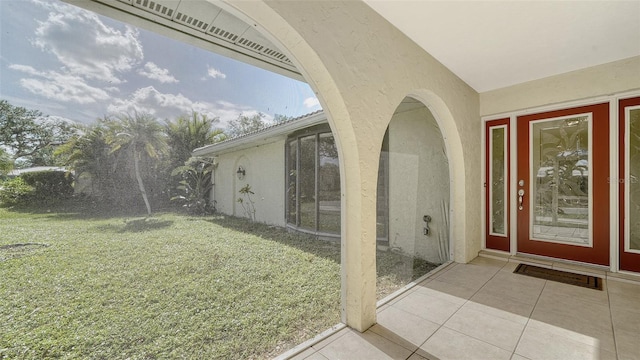 property entrance featuring a yard