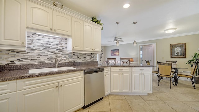 kitchen with ornamental molding, sink, stainless steel dishwasher, kitchen peninsula, and ceiling fan